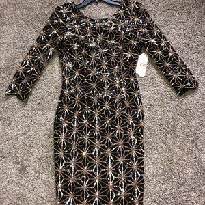 Tight fitted black and gold party dress